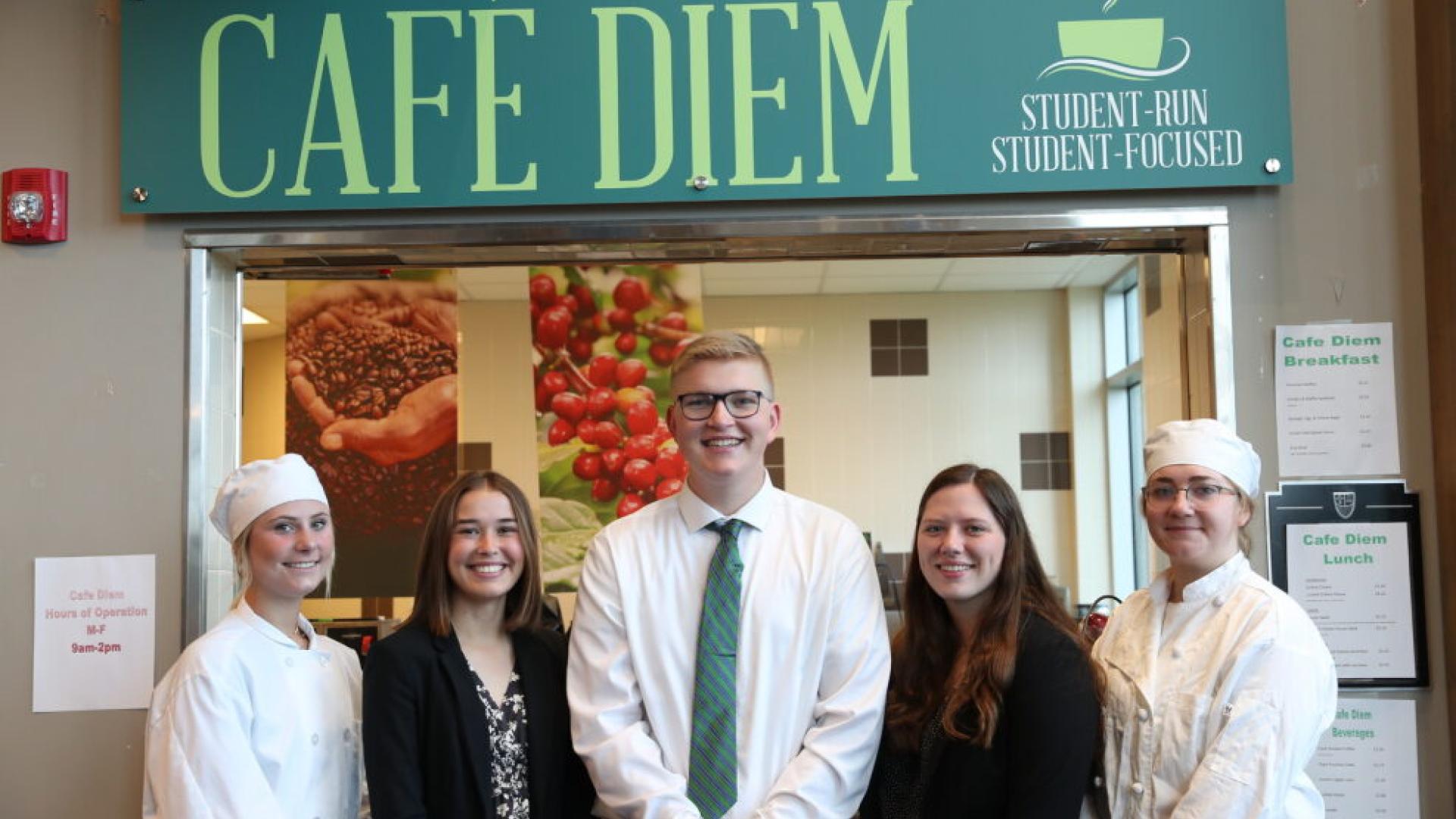 Students standing in front of Cafe Diem