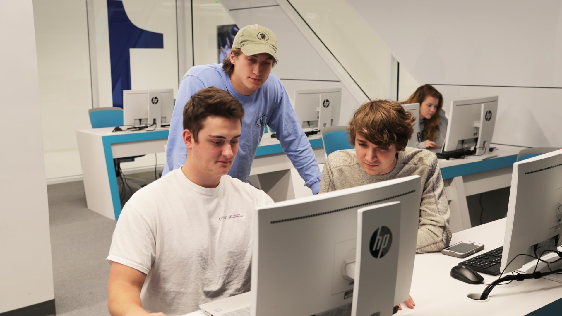 group of male students working in cyber lab