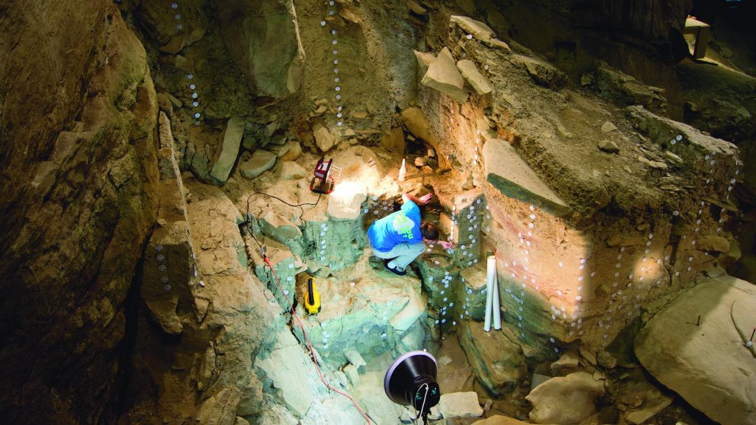 a geology student does research in a cavern