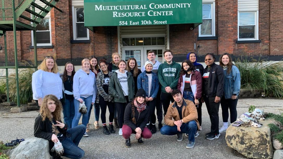 students in front of multicultural community resource center building
