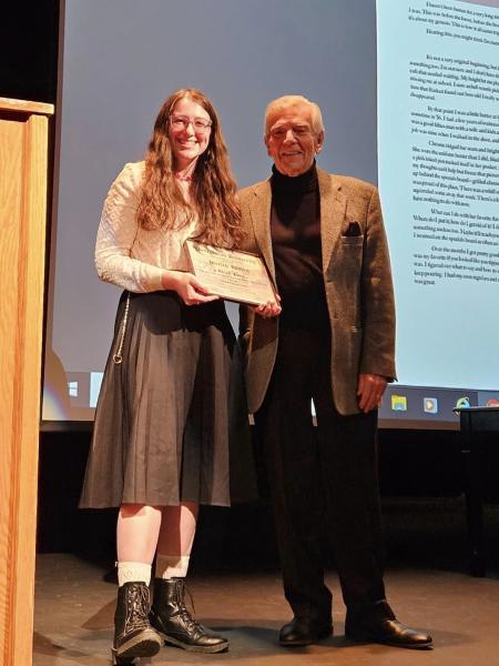 a female student receives a literary award