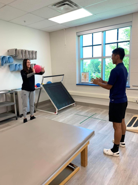 two physical therapist assistant students exercise