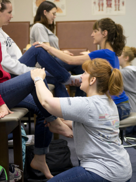physical therapist assistants stretch patients